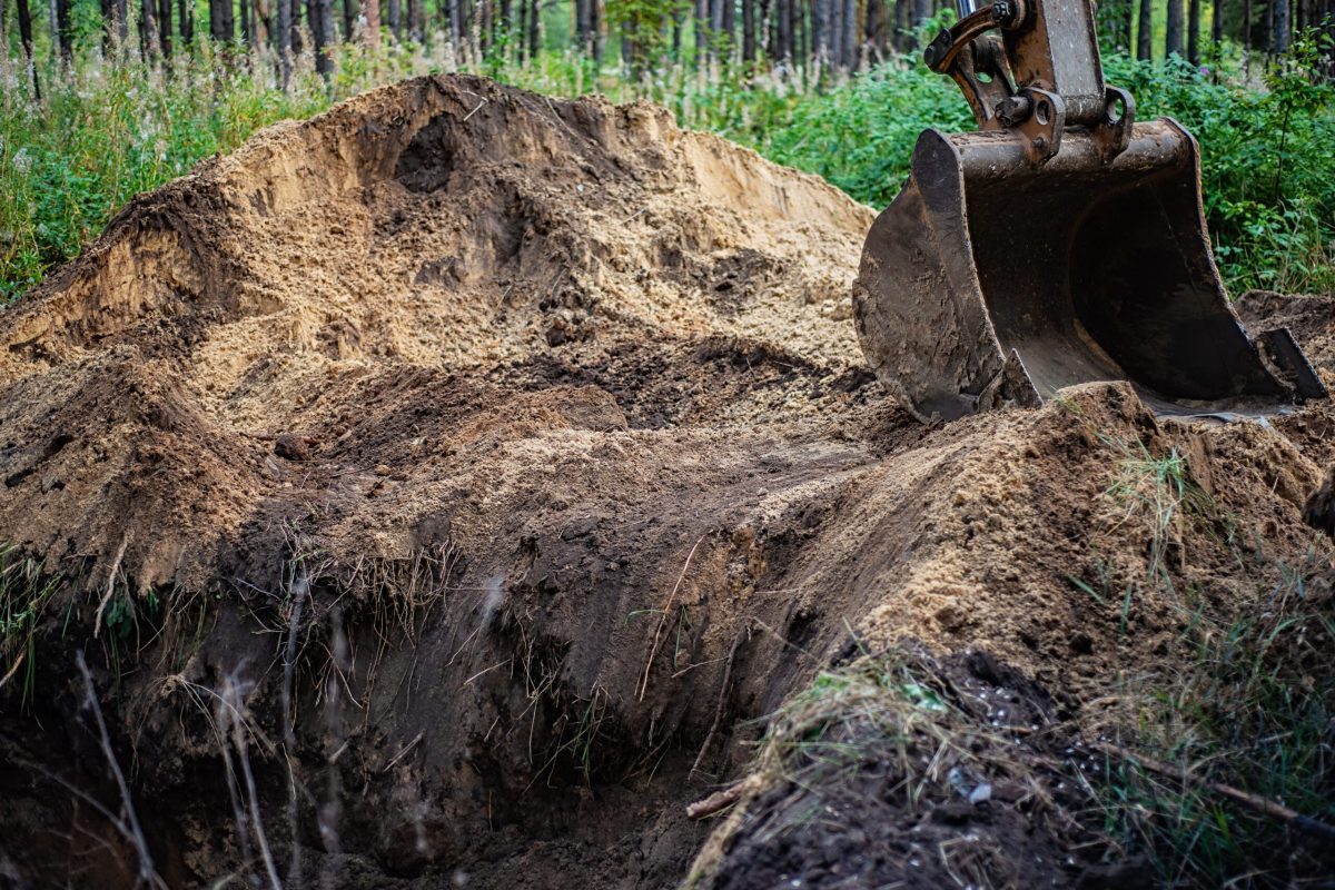 The excavator performs excavation work by digging the ground with a bucket